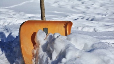 snow shovel in snow bank